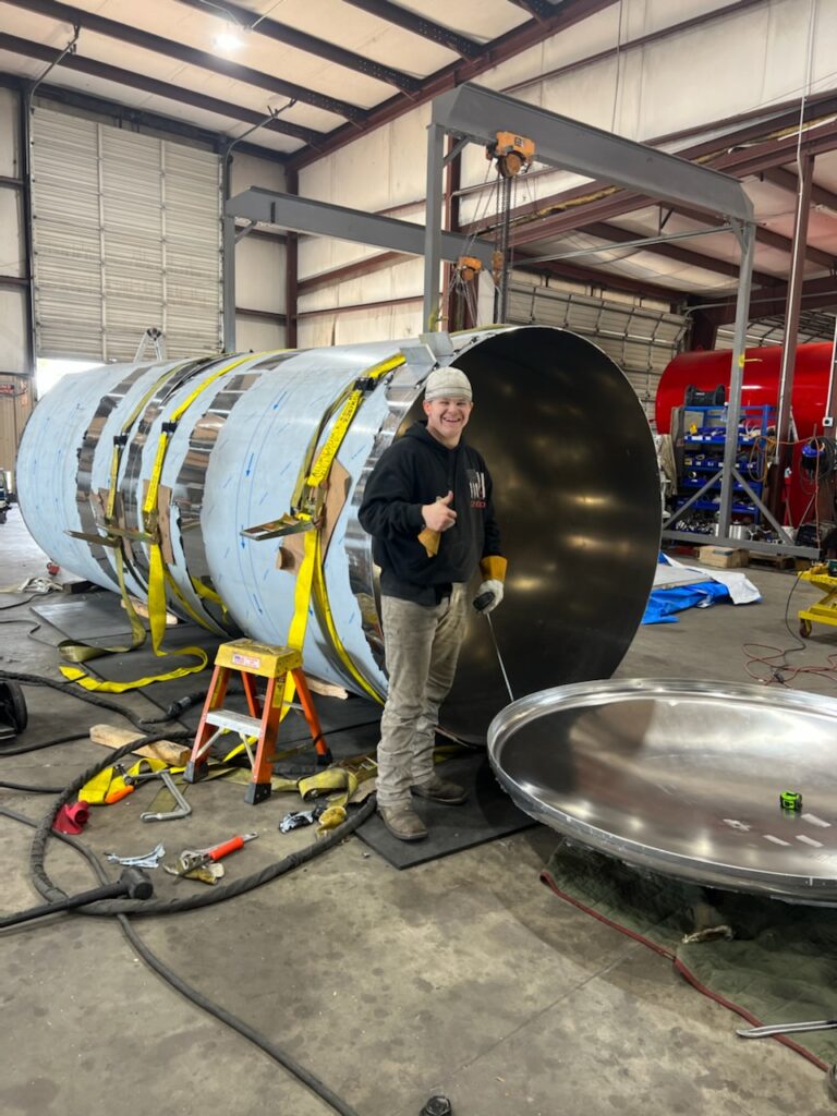 Technician servicing residential septic tank system
